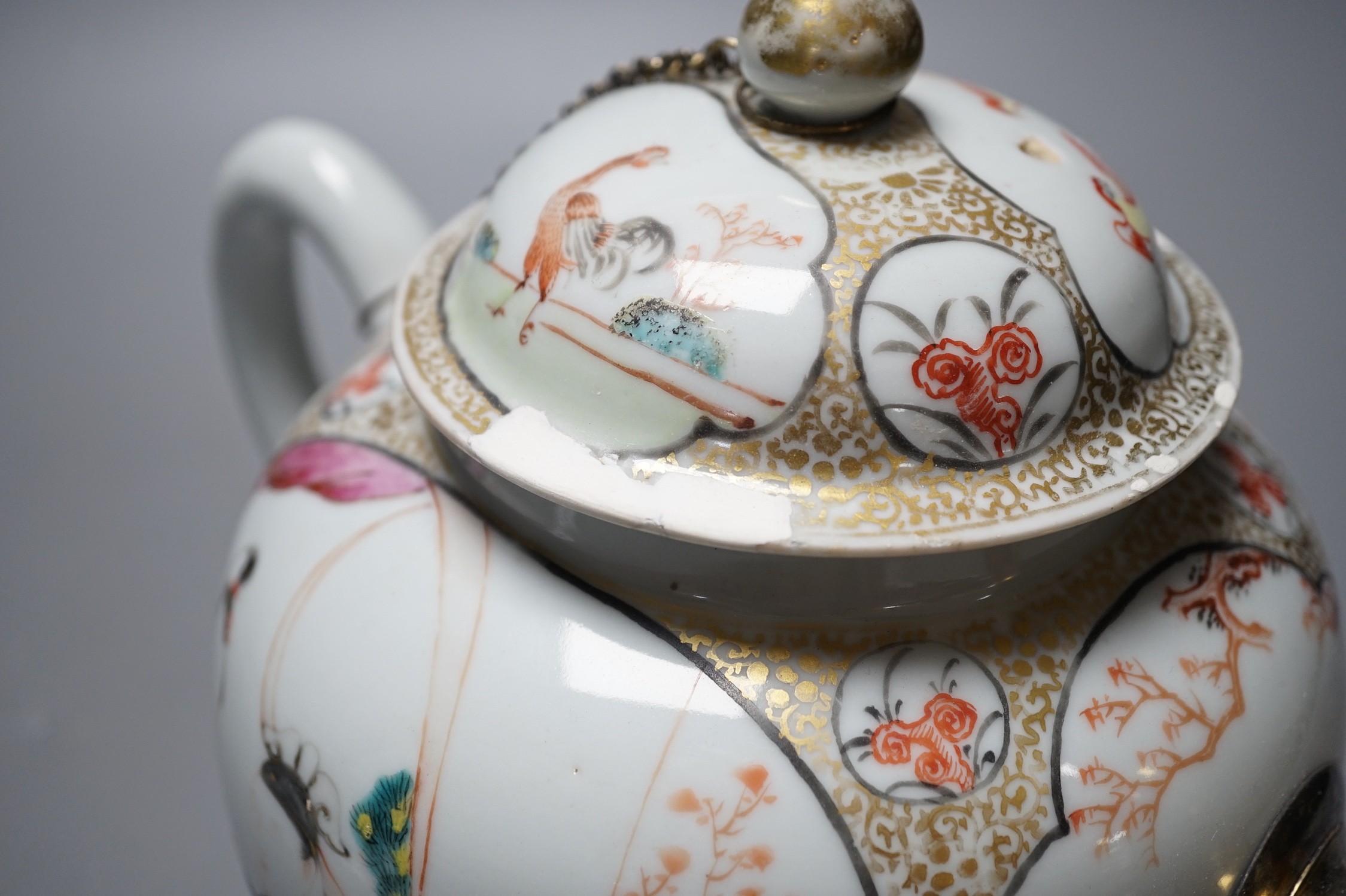 A large Chinese famille rose fencai teapot and cover, Qianlong period, replacement gilt metal spout, cover with restored chips, 20cm tall